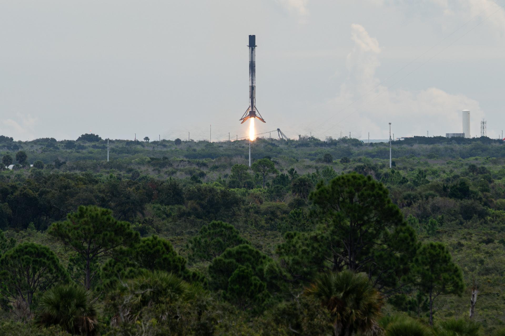 The first stage of a SpaceX Falcon 9 rocket lands at Landing Zone 40, Thursday, Oct. 1, 2026, at Cape Canaveral Space Force Station in Florida. The Falcon 9 first stage supported the launch of NASA’s SpaceX Crew-13 mission to the International Space Station with NASA astronauts Jessica Watkins and Luke Delaney, CSA (Canadian Space Agency) astronaut Joshua Kutryk, and Roscosmos cosmonaut Sergey Teteryatnikov. NASA’s SpaceX Crew-13 mission is the thirteenth crew rotation mission of the SpaceX Falcon 9 rocket and Dragon spacecraft to the International Space Station as part of the agency’s Commercial Crew Program. Watkins, Delaney, Kutryk, and Teteryatnikov launched at 11:10 a.m. EDT from Space Launch Complex 40 at Cape Canaveral Space Force Station to begin their mission aboard the orbital outpost. Photo Credit: (NASA/John Kraus)