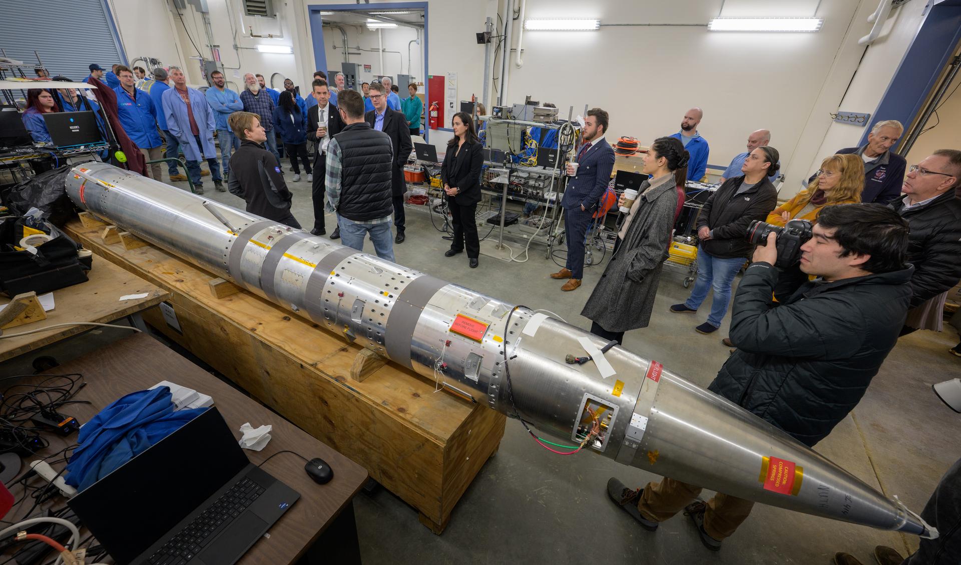NASA Administrator Jared Isaacman, and Rep. Nick Begich, R-Alaska, view the Determining Unknown yet Significant Traits DUST III sounding rocket and talk with employees while touring Poker Flat Research Range, Monday, Oct. 5, 2026, in Fairbanks, Alaska. NASA’s visit to Alaska is part of the agency's Inspiration Tour, aimed at strengthening connections between NASA and its partners and showcasing innovation in air and space in the lead up to the MAX POWER aerospace technology expo and airshow at the agency's Kennedy Space Center in early November. Photo Credit: (NASA/Bill Ingalls)