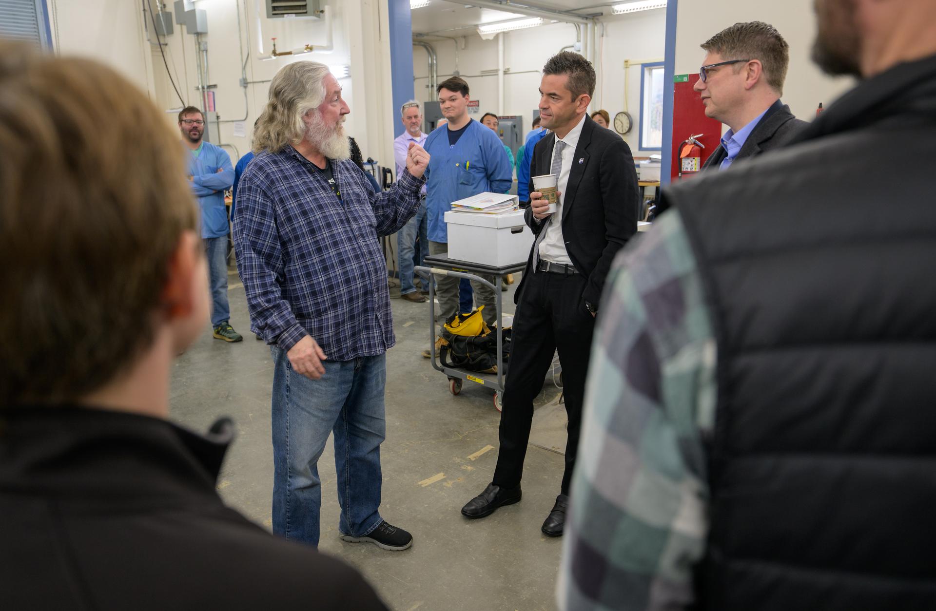 NASA Administrator Jared Isaacman, center, and Rep. Nick Begich, R-Alaska, right, talk with employees at the Poker Flat Research Range, Monday, Oct. 5, 2026, in Fairbanks, Alaska. NASA’s visit to Alaska is part of the agency's Inspiration Tour, aimed at strengthening connections between NASA and its partners and showcasing innovation in air and space in the lead up to the MAX POWER aerospace technology expo and airshow at the agency's Kennedy Space Center in early November. Photo Credit: (NASA/Bill Ingalls)