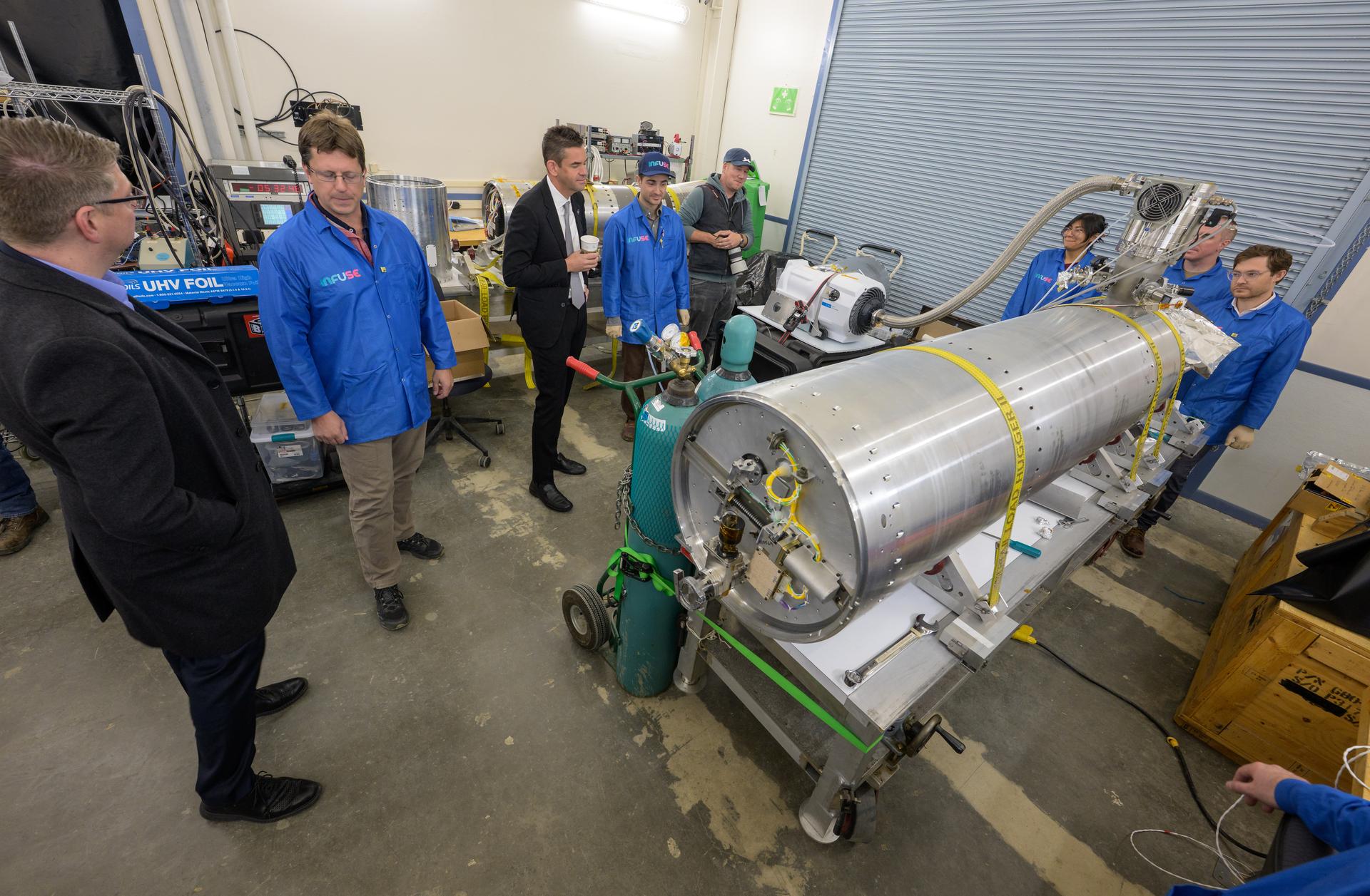 NASA Administrator Jared Isaacman, center, and Rep. Nick Begich, R-Alaska, left,  view the INtegral Field far-Ultraviolet Spectroscopic Experiment (INFUSE) and talk with employees at the Poker Flat Research Range, Monday, Oct. 5, 2026, in Fairbanks, Alaska. NASA’s visit to Alaska is part of the agency's Inspiration Tour, aimed at strengthening connections between NASA and its partners and showcasing innovation in air and space in the lead up to the MAX POWER aerospace technology expo and airshow at the agency's Kennedy Space Center in early November. Photo Credit: (NASA/Bill Ingalls)
