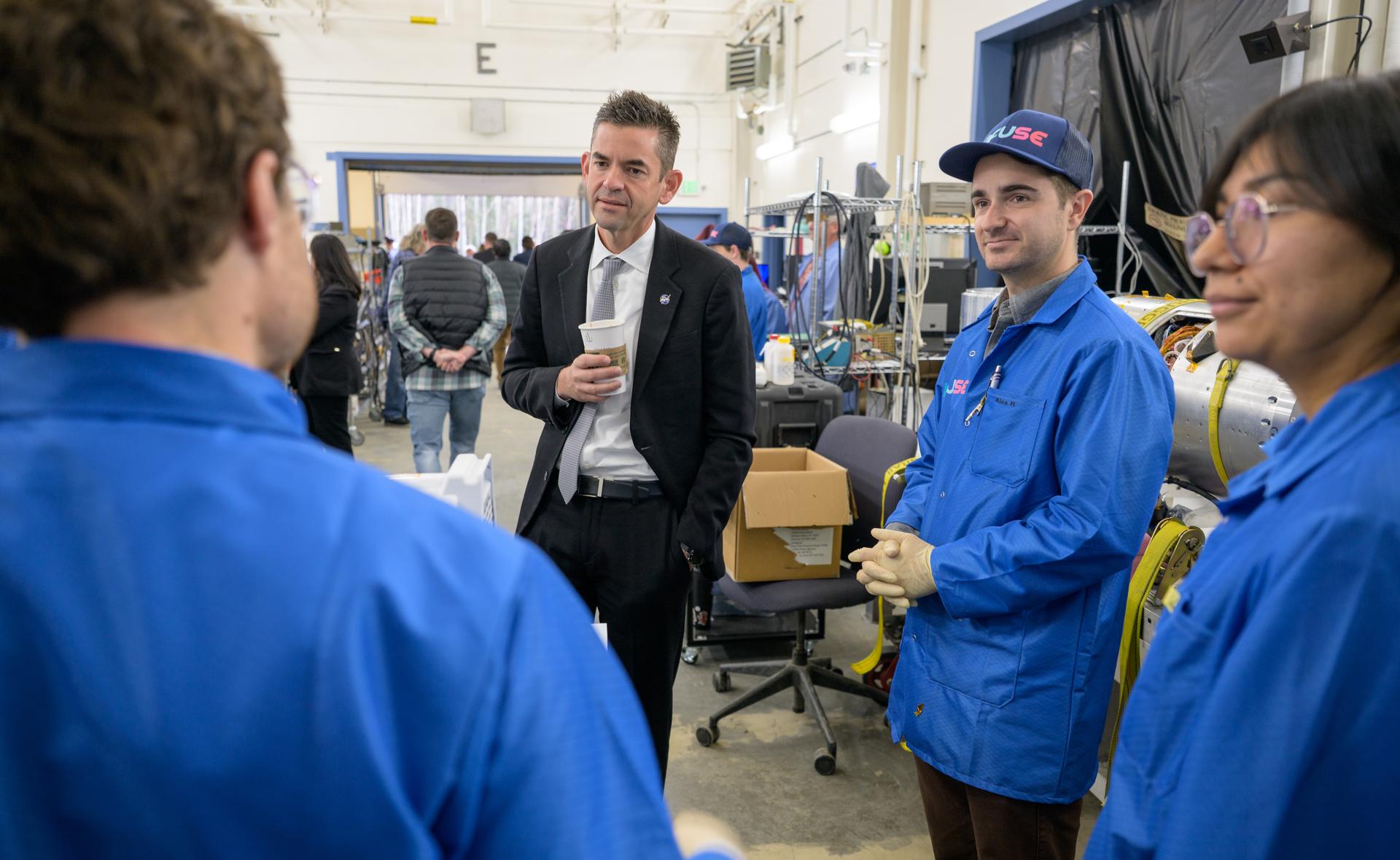 NASA Administrator Jared Isaacman, center, talks to employees working on the INtegral Field far-Ultraviolet Spectroscopic Experiment (INFUSE), at the Poker Flat Research Range, Monday, Oct. 5, 2026, in Fairbanks, Alaska. NASA’s visit to Alaska is part of the agency's Inspiration Tour, aimed at strengthening connections between NASA and its partners and showcasing innovation in air and space in the lead up to the MAX POWER aerospace technology expo and airshow at the agency's Kennedy Space Center in early November. Photo Credit: (NASA/Bill Ingalls)