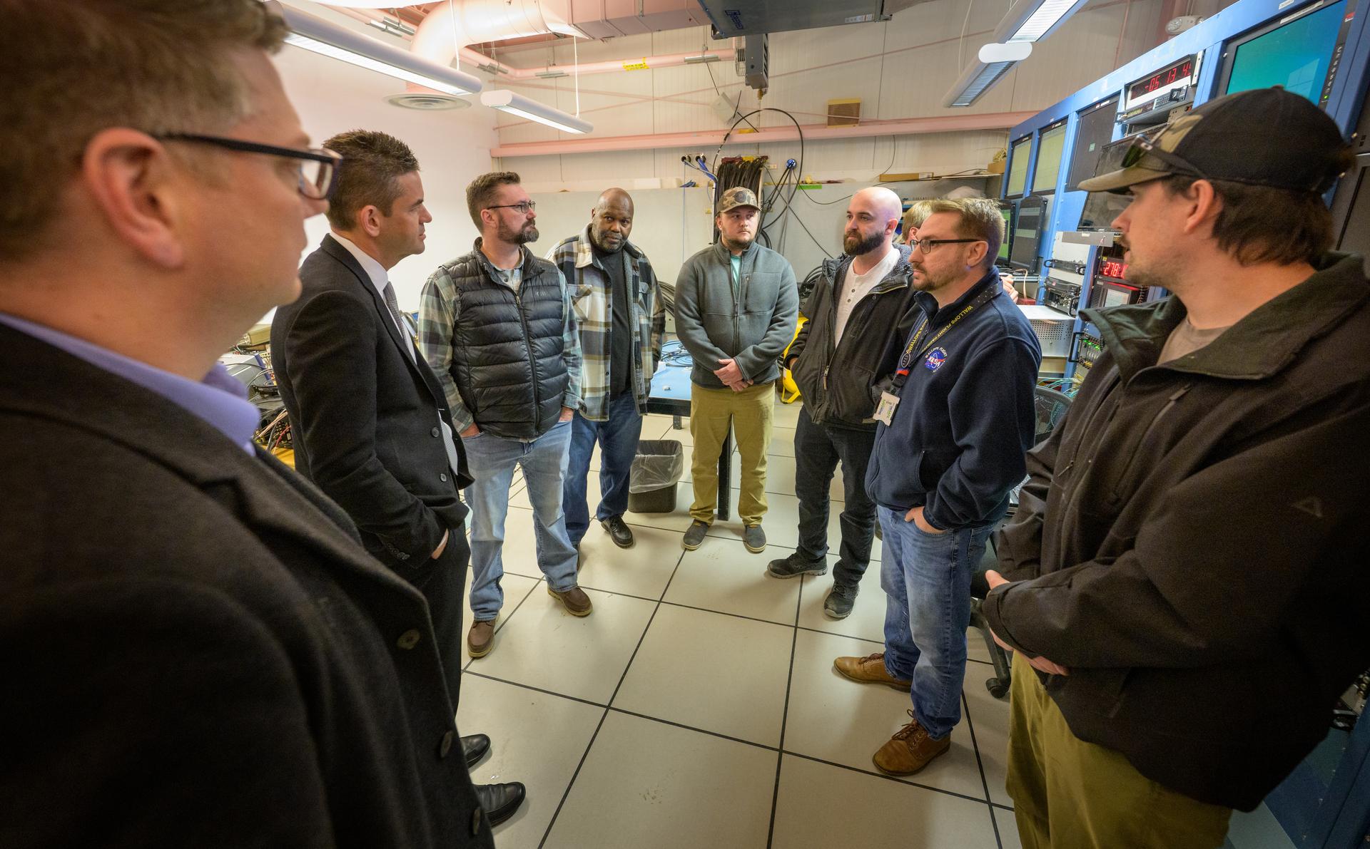 Rep. Nick Begich, R-Alaska, , left, and NASA Administrator Jared Isaacman, 2nd from left, meet with employees at the Poker Flat Research Range, Monday, Oct. 5, 2026, in Fairbanks, Alaska. NASA’s visit to Alaska is part of the agency's Inspiration Tour, aimed at strengthening connections between NASA and its partners and showcasing innovation in air and space in the lead up to the MAX POWER aerospace technology expo and airshow at the agency's Kennedy Space Center in early November. Photo Credit: (NASA/Bill Ingalls)