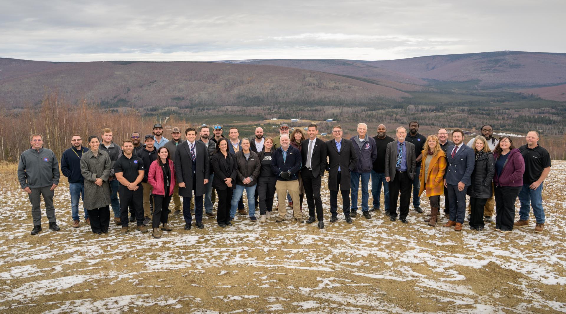 NASA Administrator Jared Isaacman, center, silver tie, along with Rep. Nick Begich, R-Alaska, pose for a group photo with employees of Poker Flat Research Range and University of Alaska Fairbanks (UAF), Monday, Oct. 5, 2026, in Fairbanks, Alaska. NASA’s visit to Alaska is part of the agency's Inspiration Tour, aimed at strengthening connections between NASA and its partners and showcasing innovation in air and space in the lead up to the MAX POWER aerospace technology expo and airshow at the agency's Kennedy Space Center in early November. Photo Credit: (NASA/Bill Ingalls)