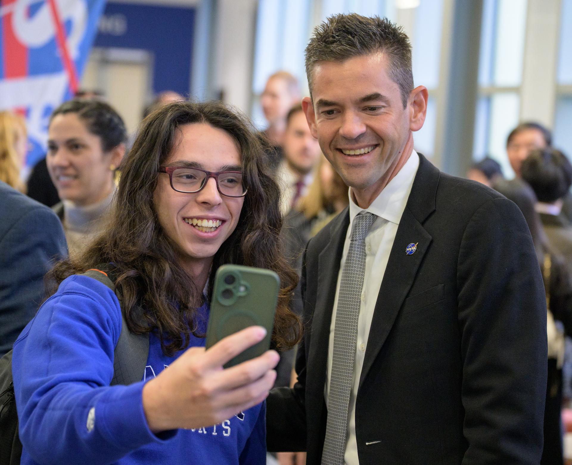 NASA Administrator Jared Isaacman takes a selfie with students during a NASA Town Hall, Monday, Oct. 5, 2026, at the University of Alaska Fairbanks, in Fairbanks, Alaska. NASA’s visit to Alaska is part of the agency's Inspiration Tour, aimed at strengthening connections between NASA and its partners and showcasing innovation in air and space in the lead up to the MAX POWER aerospace technology expo and airshow at the agency's Kennedy Space Center in early November. Photo Credit: (NASA/Bill Ingalls)