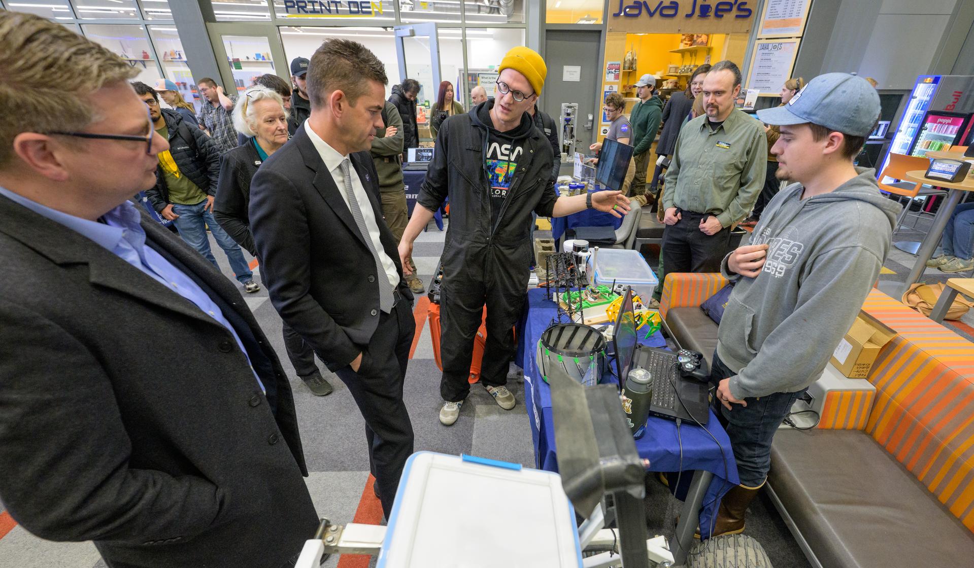 Rep. Nick Begich, R-Alaska, left, and NASA Administrator Jared Isaacman, meet with Space Grant students during a Science Fare, Monday, Oct. 5, 2026, at the University of Alaska Fairbanks, in Fairbanks, Alaska. NASA’s visit to Alaska is part of the agency's Inspiration Tour, aimed at strengthening connections between NASA and its partners and showcasing innovation in air and space in the lead up to the MAX POWER aerospace technology expo and airshow at the agency's Kennedy Space Center in early November. Photo Credit: (NASA/Bill Ingalls)
