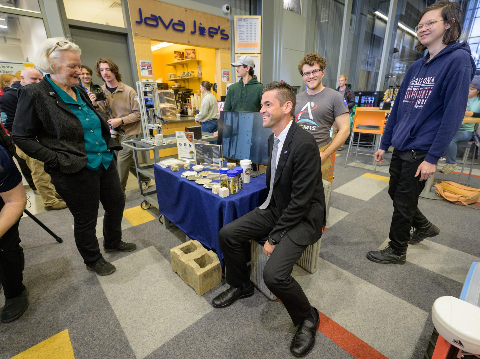 NASA Administrator Jared Isaacman, tries a 3D printed lunar regolith simulant chair as he meets with Space Grant students during a Science Fare, Monday, Oct. 5, 2026, at the University of Alaska Fairbanks, in Fairbanks, Alaska. NASA’s visit to Alaska is part of the agency's Inspiration Tour, aimed at strengthening connections between NASA and its partners and showcasing innovation in air and space in the lead up to the MAX POWER aerospace technology expo and airshow at the agency's Kennedy Space Center in early November. Photo Credit: (NASA/Bill Ingalls)