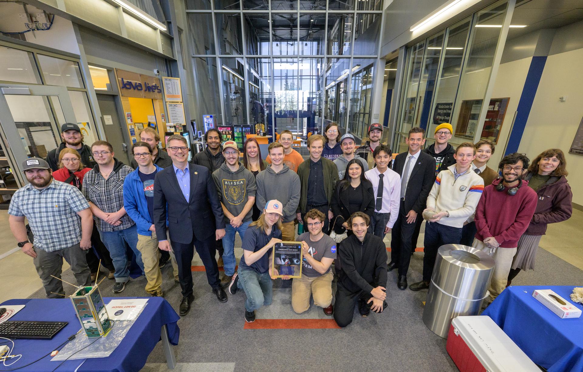 NASA Administrator Jared Isaacman, 6th from right, Rep. Nick Begich, R-Alaska, 7th from left, and Alaska Space Grant students, pose for a group photograph at a science fare, Monday, Oct. 5, 2026, at the University of Alaska Fairbanks, in Fairbanks, Alaska. NASA’s visit to Alaska is part of the agency's Inspiration Tour, aimed at strengthening connections between NASA and its partners and showcasing innovation in air and space in the lead up to the MAX POWER aerospace technology expo and airshow at the agency's Kennedy Space Center in early November. Photo Credit: (NASA/Bill Ingalls)