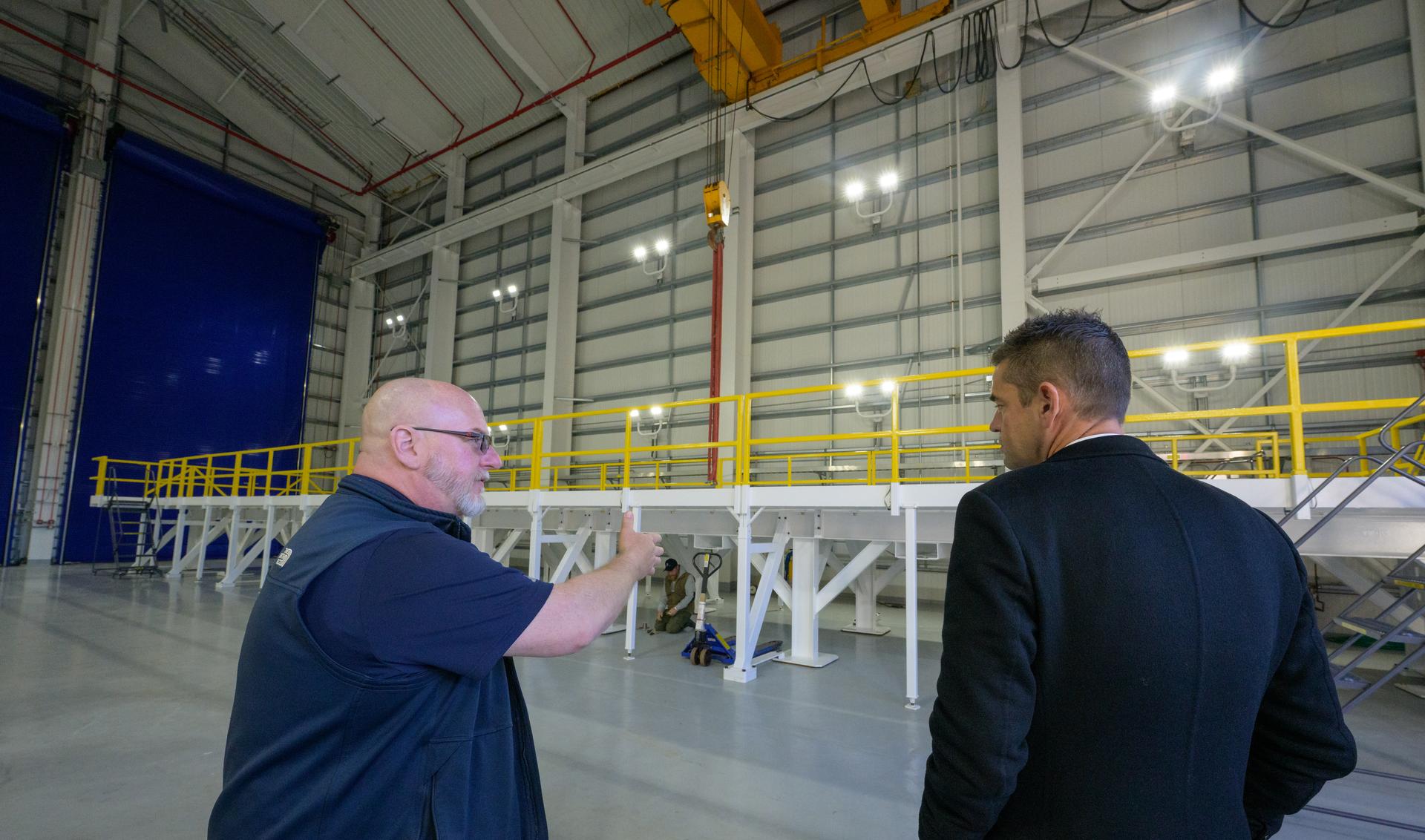 Erik Straus, Alaska Aerospace Spaceport Manger, left, talks with NASA Administrator Jared Isaacman, in the Integration Processing Facility at the Pacific Spaceport Complex-Alaska, Tuesday, Oct. 6, 2026, in Kodiak, Alaska. NASA’s visit to Alaska is part of the agency's Inspiration Tour, aimed at strengthening connections between NASA and its partners and showcasing innovation in air and space in the lead up to the MAX POWER aerospace technology expo and airshow at the agency's Kennedy Space Center in early November. Photo Credit: (NASA/Bill Ingalls)
