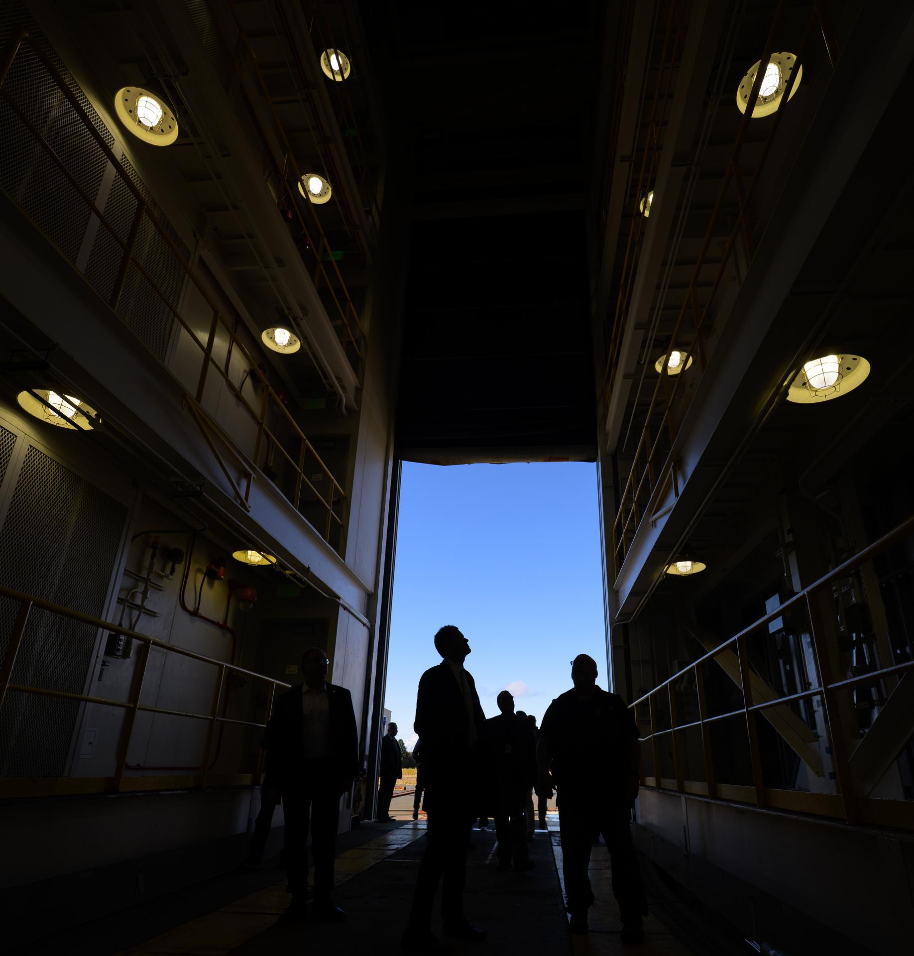 NASA Administrator Jared Isaacman, in profile silhouette, tours the Pacific Spaceport Complex-Alaska, Tuesday, Oct. 6, 2026, in Kodiak, Alaska. NASA’s visit to Alaska is part of the agency's Inspiration Tour, aimed at strengthening connections between NASA and its partners and showcasing innovation in air and space in the lead up to the MAX POWER aerospace technology expo and airshow at the agency's Kennedy Space Center in early November. Photo Credit: (NASA/Bill Ingalls)