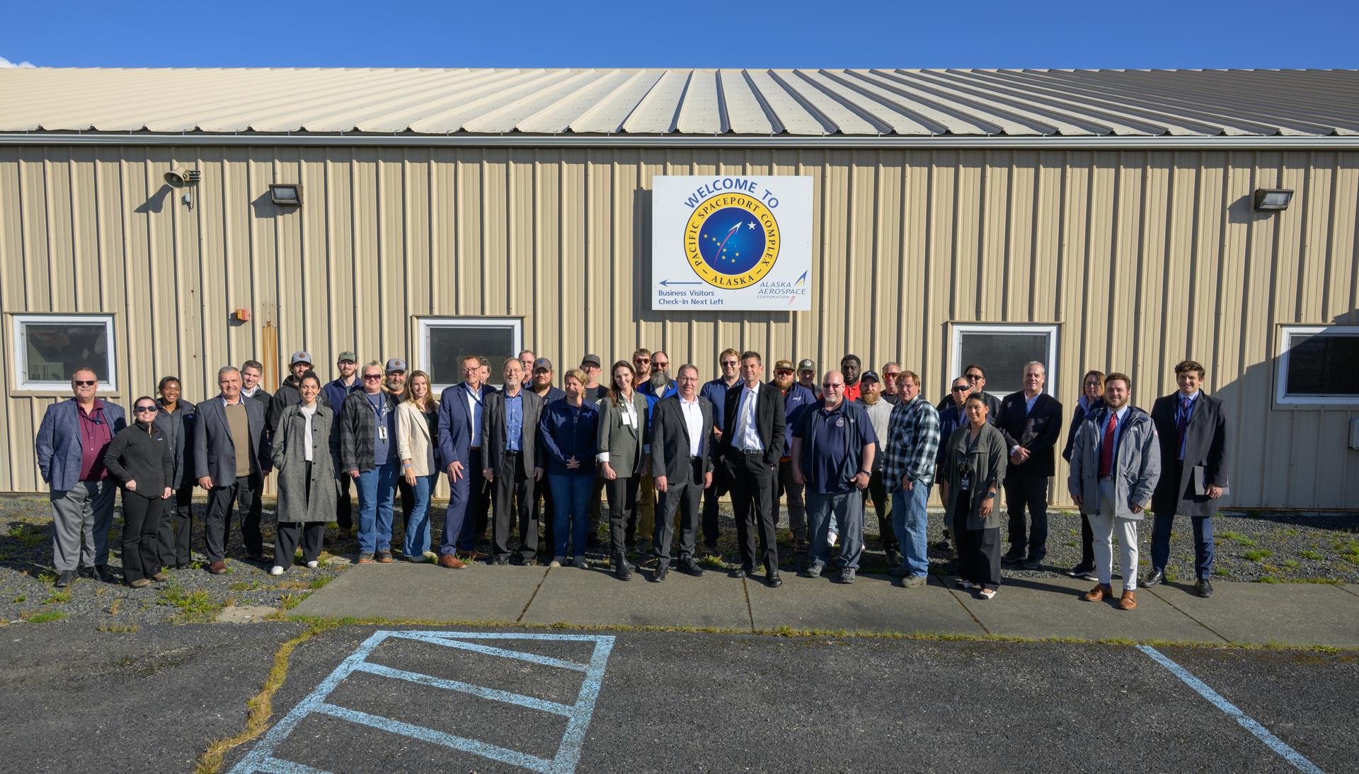 NASA Administrator Jared Isaacman, poses for a group photograph with Alaska Aerospace employees at the Pacific Spaceport Complex-Alaska, Tuesday, Oct. 6, 2026, in Kodiak, Alaska. NASA’s visit to Alaska is part of the agency's Inspiration Tour, aimed at strengthening connections between NASA and its partners and showcasing innovation in air and space in the lead up to the MAX POWER aerospace technology expo and airshow at the agency's Kennedy Space Center in early November. Photo Credit: (NASA/Bill Ingalls)
