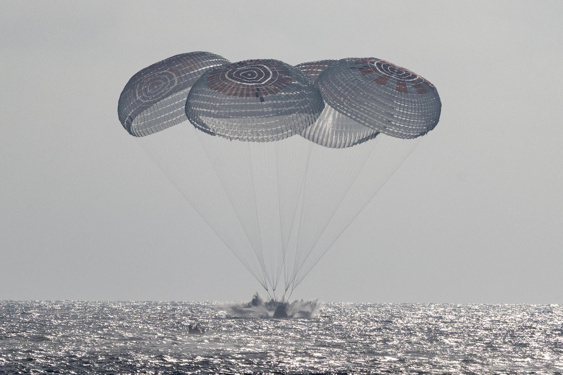 The SpaceX Crew Dragon Freedom spacecraft is seen as it lands with NASA astronauts Jessica Meir, Jack Hathaway, ESA (European Space Agency) astronaut Sophie Adenot, and Roscosmos cosmonaut Andrey Fedyaev aboard in the Pacific Ocean off the coast of Los Angeles, Calif., Thursday, Oct. 8, 2026. Meir, Hathaway, Adenot, and Fedyaev are returning after seven-months in space as part of Expedition 74 aboard the International Space Station. Photo Credit: (NASA/Keegan Barber)