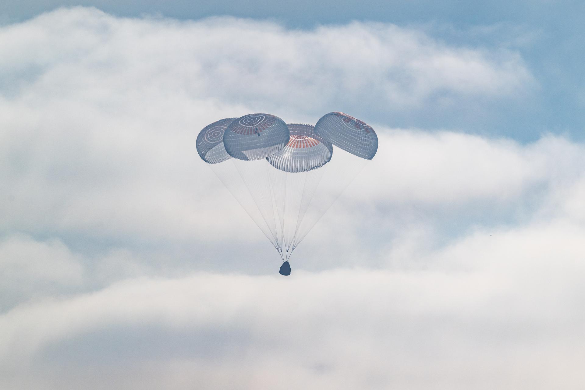 The SpaceX Crew Dragon Freedom spacecraft is seen as it lands with NASA astronauts Jessica Meir, Jack Hathaway, ESA (European Space Agency) astronaut Sophie Adenot, and Roscosmos cosmonaut Andrey Fedyaev aboard in the Pacific Ocean off the coast of Los Angeles, Calif., Thursday, Oct. 8, 2026. Meir, Hathaway, Adenot, and Fedyaev are returning after seven-months in space as part of Expedition 74 aboard the International Space Station. Photo Credit: (NASA/Keegan Barber)