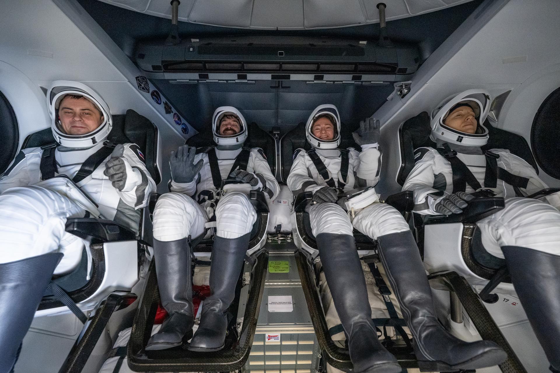 Roscosmos cosmonaut Andrey Fedyaev, left, NASA astronauts Jack Hathaway and Jessica Meir, and ESA (European Space Agency) astronaut Sophie Adenot are seen inside the SpaceX Dragon Freedom spacecraft onboard the SpaceX recovery ship SHANNON shortly after having landed in the Pacific Ocean off the coast of Los Angeles, Calif., Thursday, Oct. 8, 2026. Meir, Hathaway, Adenot, and Fedyaev are returning after seven-months in space as part of Expedition 74 aboard the International Space Station. Photo Credit: (NASA/Keegan Barber)