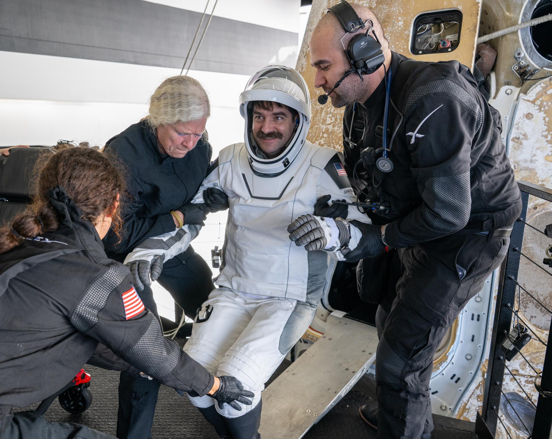 NASA astronaut Jack Hathaway helped out of the SpaceX Dragon Freedom spacecraft onboard the SpaceX recovery ship SHANNON after he, NASA astronaut Jessica Meir, ESA (European Space Agency) astronaut Sophie Adenot, and Roscosmos cosmonaut Andrey Fedyaev landed in the Pacific Ocean off the coast of Los Angeles, Calif., Thursday, Oct. 8, 2026. Meir, Hathaway, Adenot, and Fedyaev are returning after seven-months in space as part of Expedition 74 aboard the International Space Station. Photo Credit: (NASA/Keegan Barber)