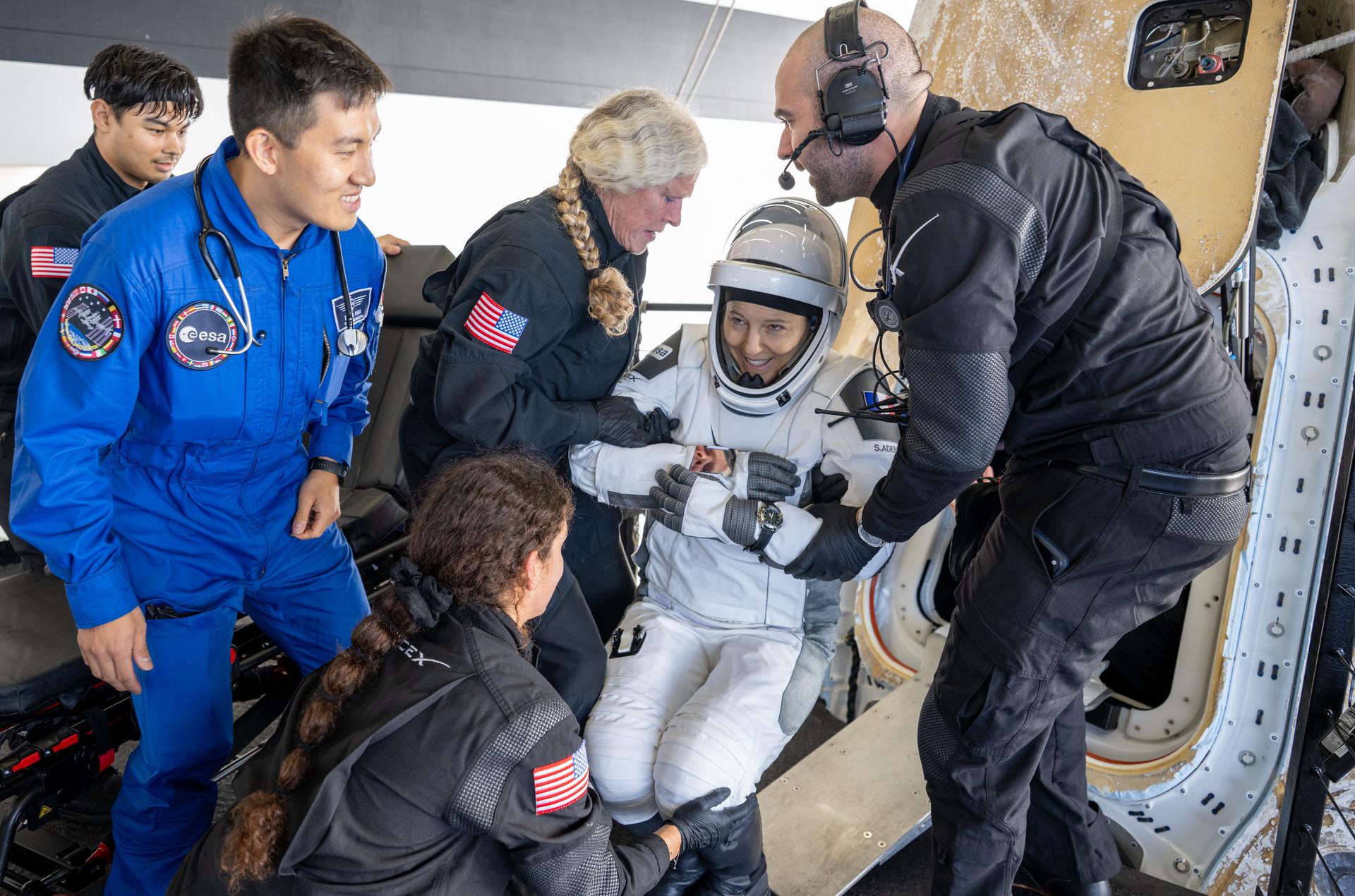 ESA (European Space Agency) astronaut Sophie Adenot is helped out of the SpaceX Dragon Freedom spacecraft onboard the SpaceX recovery ship SHANNON after she and NASA astronauts Jessica Meir, Jack Hathaway, and Roscosmos cosmonaut Andrey Fedyaev landed in the Pacific Ocean off the coast of Los Angeles, Calif., Thursday, Oct. 8, 2026. Meir, Hathaway, Adenot, and Fedyaev are returning after seven-months in space as part of Expedition 74 aboard the International Space Station. Photo Credit: (NASA/Keegan Barber)
