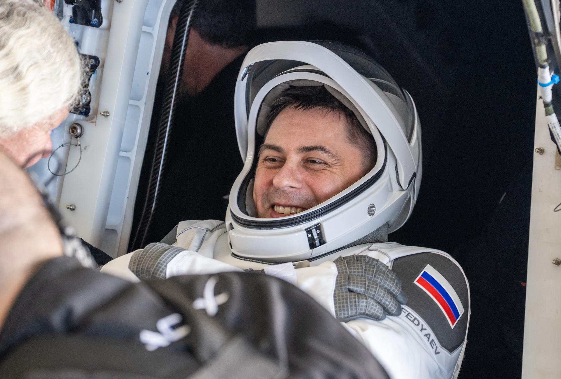 Roscosmos cosmonaut Andrey Fedyaev is helped out of the SpaceX Dragon Freedom spacecraft onboard the SpaceX recovery ship SHANNON after he, NASA astronauts Jack Hathaway, Jessica Meir, and ESA (European Space Agency) astronaut Sophie Adenot landed in the Pacific Ocean off the coast of Los Angeles, Calif., Thursday, Oct. 8, 2026. Meir, Hathaway, Adenot, and Fedyaev are returning after seven-months in space as part of Expedition 74 aboard the International Space Station. Photo Credit: (NASA/Keegan Barber)