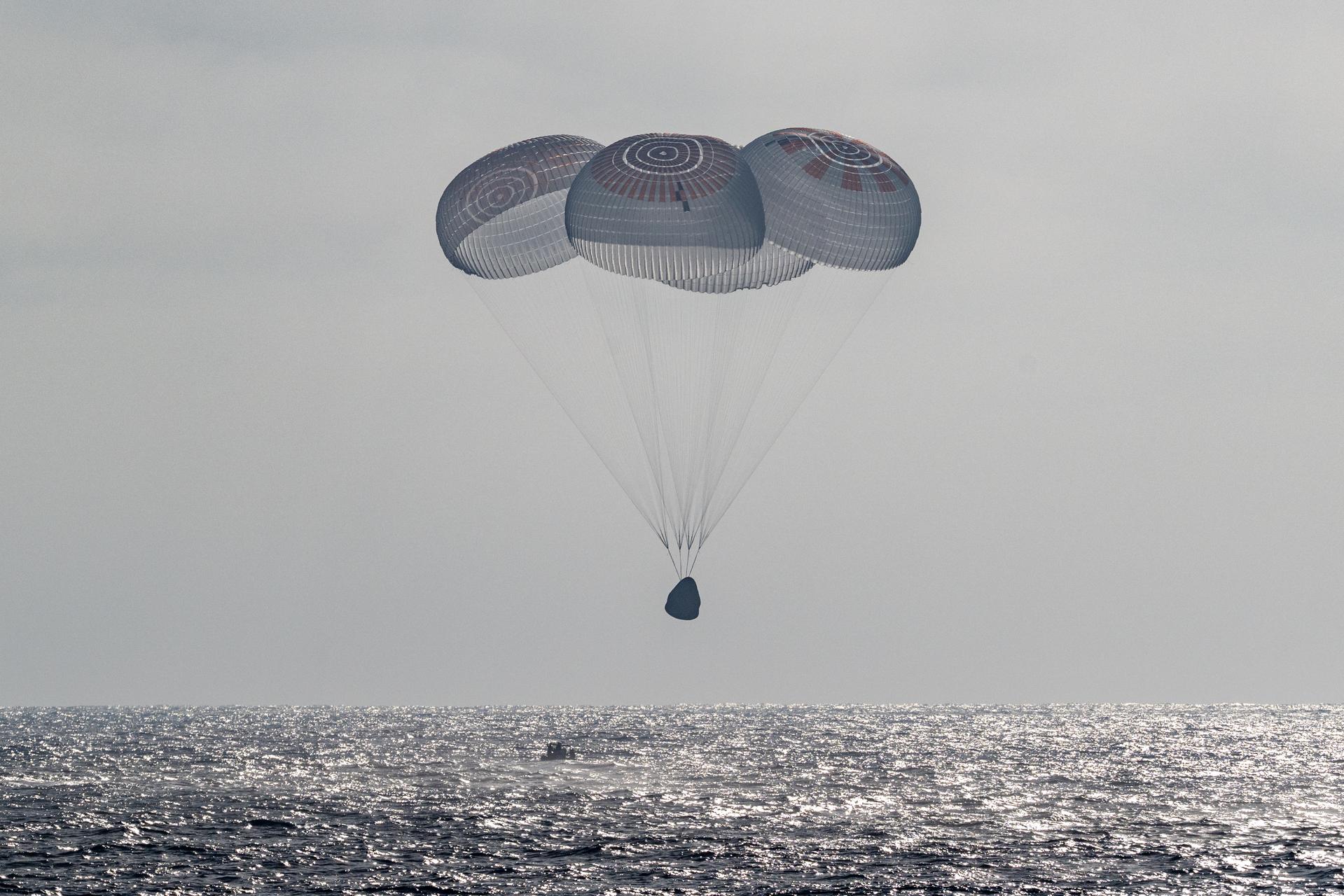 The SpaceX Crew Dragon Freedom spacecraft is seen as it lands with NASA astronauts Jessica Meir, Jack Hathaway, ESA (European Space Agency) astronaut Sophie Adenot, and Roscosmos cosmonaut Andrey Fedyaev aboard in the Pacific Ocean off the coast of Los Angeles, Calif., Thursday, Oct. 8, 2026. Meir, Hathaway, Adenot, and Fedyaev are returning after seven-months in space as part of Expedition 74 aboard the International Space Station. Photo Credit: (NASA/Keegan Barber)