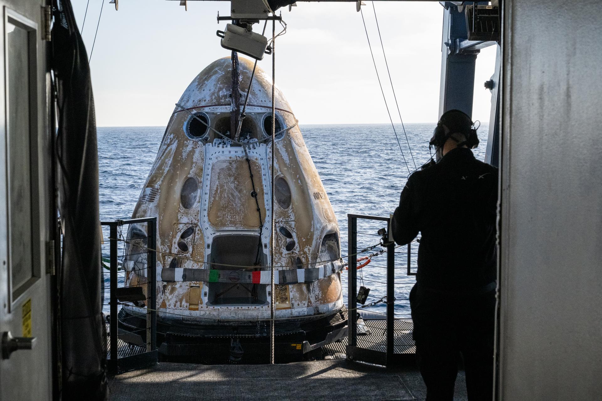 Support teams onboard the SpaceX recovery ship SHANNON work around the SpaceX Dragon Freedom spacecraft shortly after it landed with NASA astronauts Jessica Meir, Jack Hathaway, ESA (European Space Agency) astronaut Sophie Adenot, and Roscosmos cosmonaut Andrey Fedyaev aboard in the Pacific Ocean off the coast of Los Angeles, Calif., Thursday, Oct. 8, 2026. Meir, Hathaway, Adenot, and Fedyaev are returning after seven-months in space as part of Expedition 74 aboard the International Space Station. Photo Credit: (NASA/Keegan Barber)
