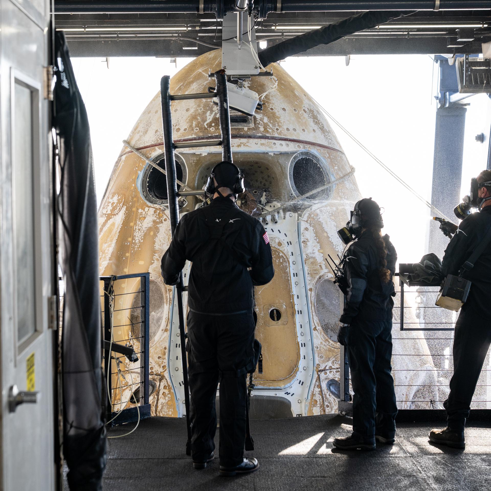 Support teams onboard the SpaceX recovery ship SHANNON work around the SpaceX Dragon Freedom spacecraft shortly after it landed with NASA astronauts Jessica Meir, Jack Hathaway, ESA (European Space Agency) astronaut Sophie Adenot, and Roscosmos cosmonaut Andrey Fedyaev aboard in the Pacific Ocean off the coast of Los Angeles, Calif., Thursday, Oct. 8, 2026. Meir, Hathaway, Adenot, and Fedyaev are returning after seven-months in space as part of Expedition 74 aboard the International Space Station. Photo Credit: (NASA/Keegan Barber)