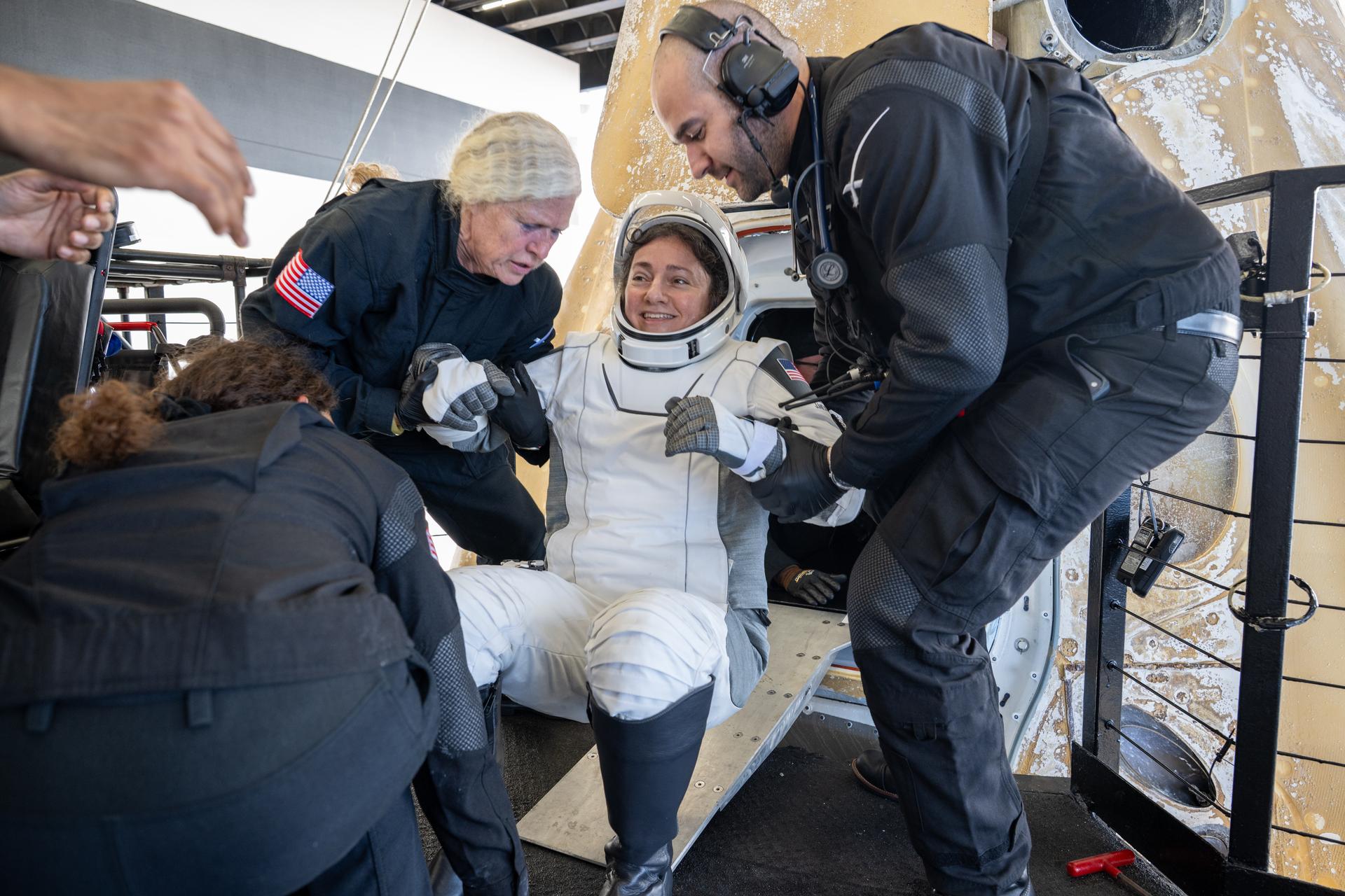 NASA astronaut Jessica Meir is helped out of the SpaceX Dragon Freedom spacecraft onboard the SpaceX recovery ship SHANNON after she, NASA astronaut Jack Hathaway, ESA (European Space Agency) astronaut Sophie Adenot, and Roscosmos cosmonaut Andrey Fedyaev landed in the Pacific Ocean off the coast of Los Angeles, Calif., Thursday, Oct. 8, 2026. Meir, Hathaway, Adenot, and Fedyaev are returning after seven-months in space as part of Expedition 74 aboard the International Space Station. Photo Credit: (NASA/Keegan Barber)