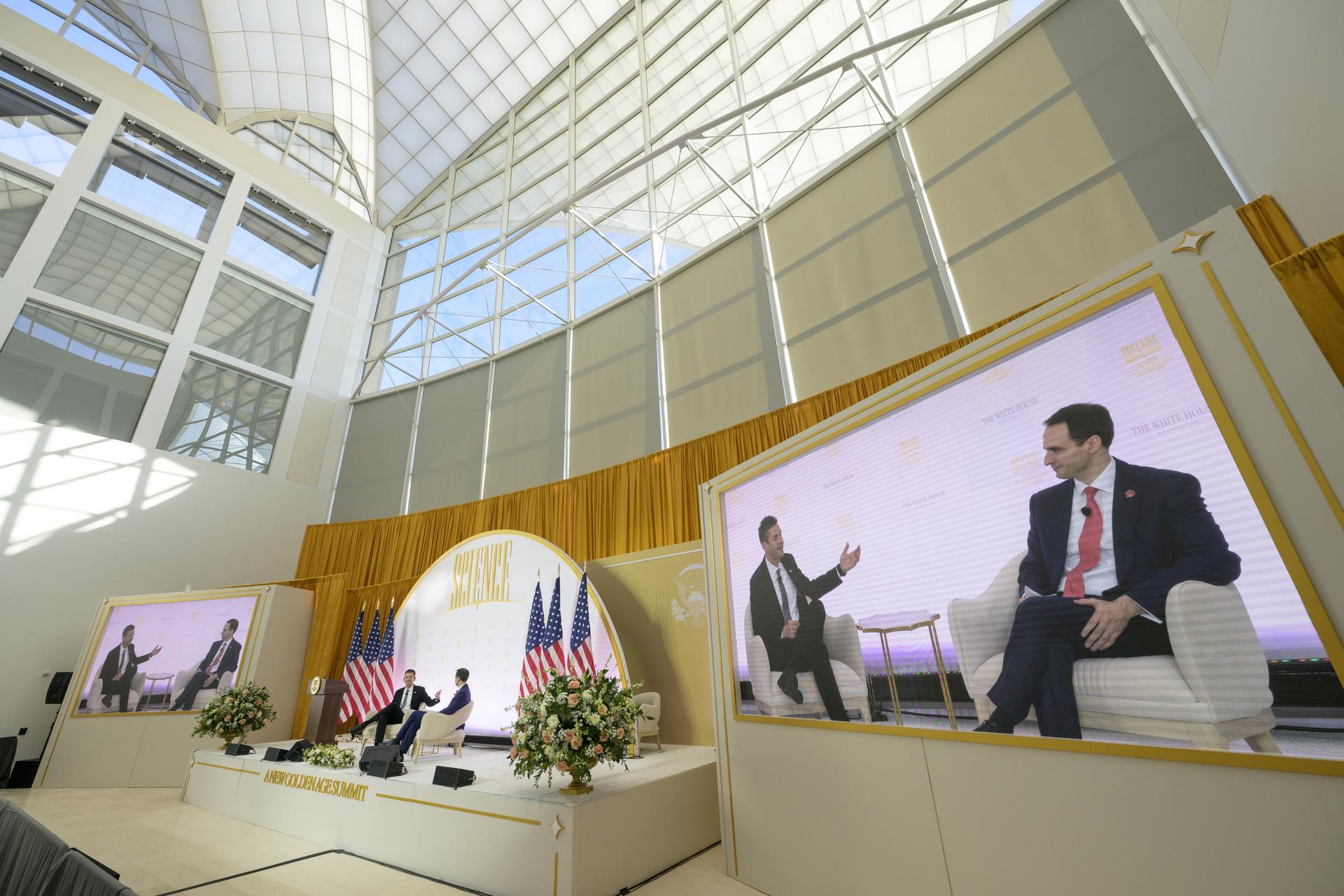 NASA Administrator Jared Isaacman, left, participates in a fireside chat with Director of the White House Office of Science and Technology Policy (OSTP) Michael Kratsios during the Golden Age Summit, Thursday, Oct. 8, 2026, at the Donald J. Trump Institute of Peace in Washington. Photo Credit: (NASA/Bill Ingalls)