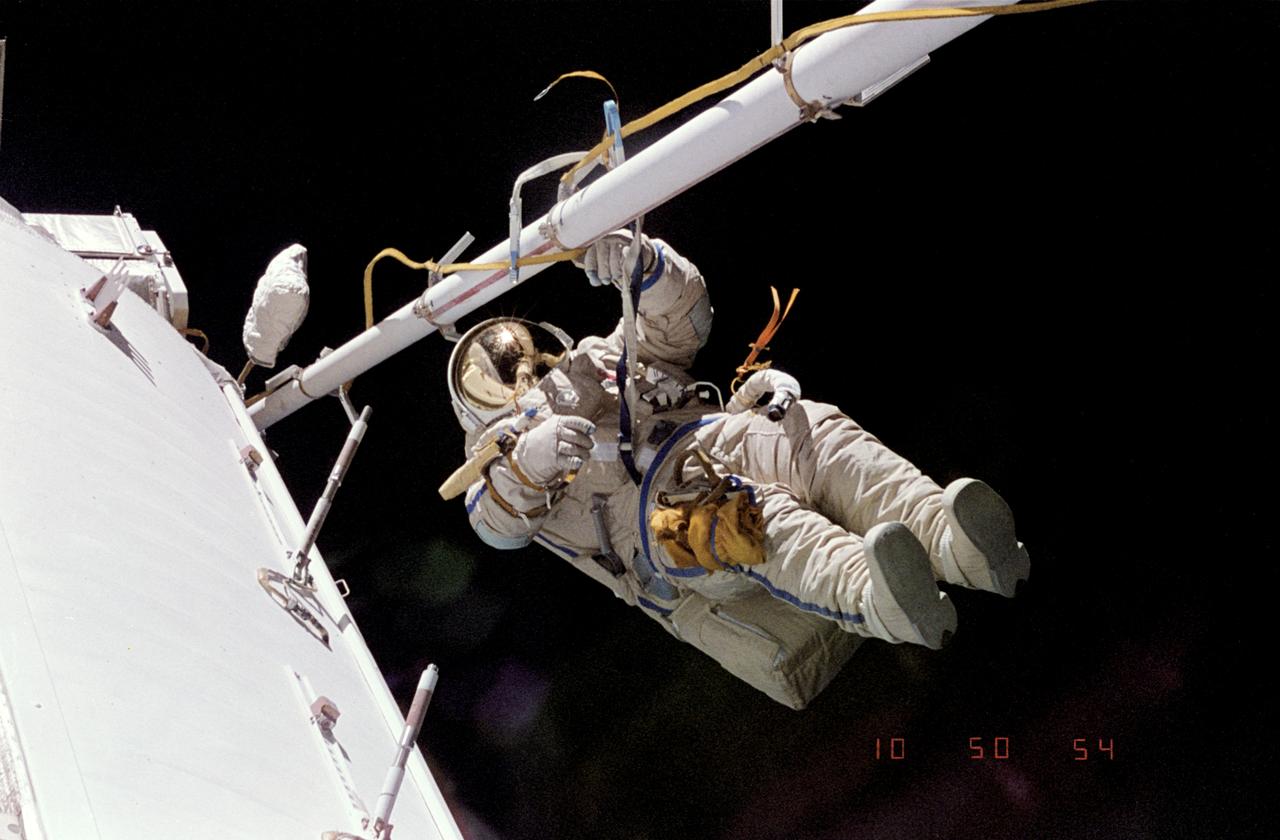 NM18-305-023 (March-July 1995) --- Cosmonaut Gennadiy M. Strekalov, Mir-18 flight engineer, is photographed during one of five space walks conducted by the Mir-18 crew.  This is one of many visuals shown during a July 18, 1995, press conference in Houston, Texas.
