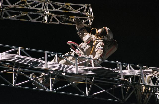 NASA image: Mir 21 cosmonauts assemble a truss during EVA