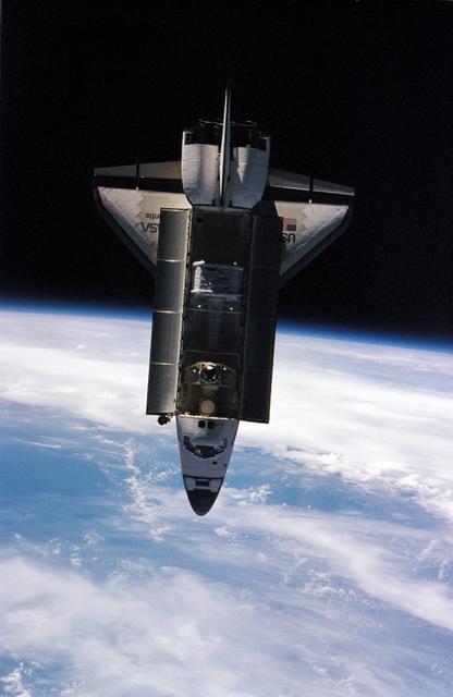 NASA image: View of Space Shuttle Atlantis during approach and docking to Mir Space Station