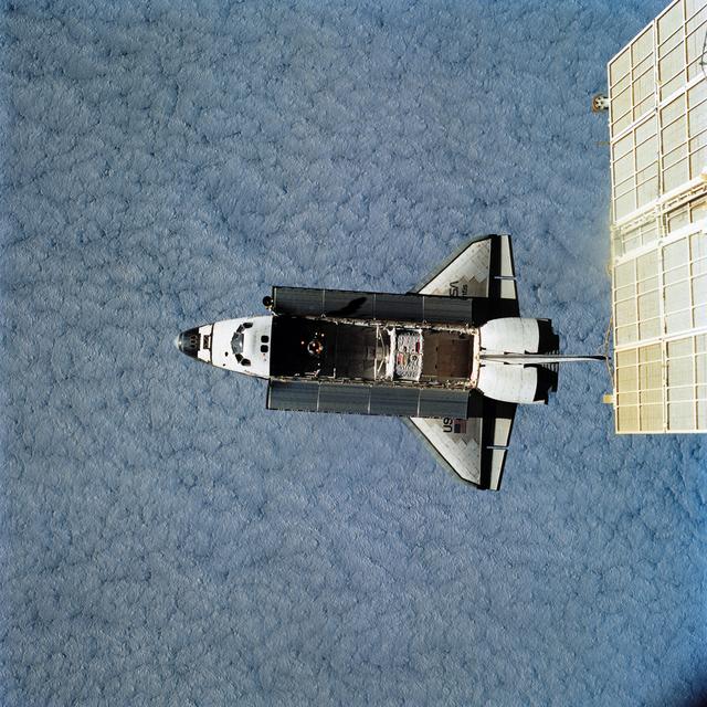 NASA image: View of Space Shuttle Atlantis during approach and docking to Mir Space Station