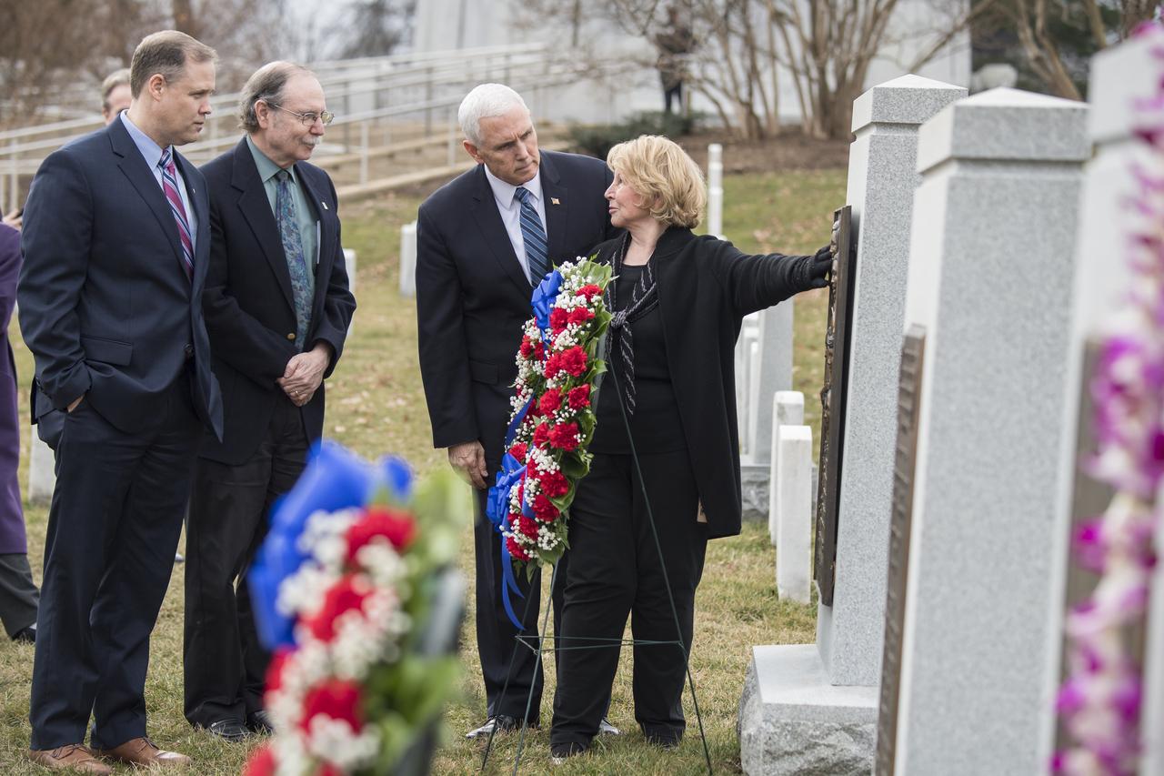 June Scobee-Rodgers, widow of Challenger Commander Dick Scobee, right, speaks with NASA Administrator Jim Bridenstine, left, Chuck Resnik, brother of Challenger Mission Specialist Judith Resnik, second left, and Vice President Mike Pence at the Space Shuttle Challenger Memorial after a wreath laying ceremony that was part of NASA's Day of Remembrance, Thursday, Feb. 7, 2019, at Arlington National Cemetery in Arlington, Va. Wreaths were laid in memory of those men and women who lost their lives in the quest for space exploration.  Photo Credit: (NASA/Aubrey Gemignani)