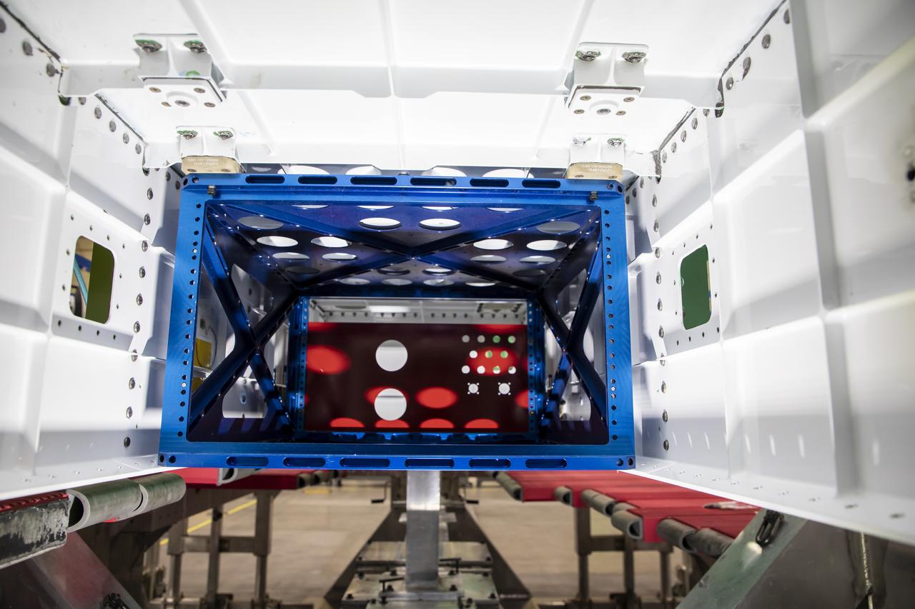 Following the successful installation of mounting brackets, technicians successfully installed the pallet for the eXternal Visibility System, or XVS, onto the X-59 Quiet SuperSonic Technology X-plane, also known as X-59 QueSST. The pallet installation marks an assembly milestone as the first NASA flight systems hardware to be installed onto the vehicle. X-59 will fly to demonstrate the ability to produce quiet thumps at supersonic speeds, instead of the typical, loud sonic booms associated with supersonic flight.