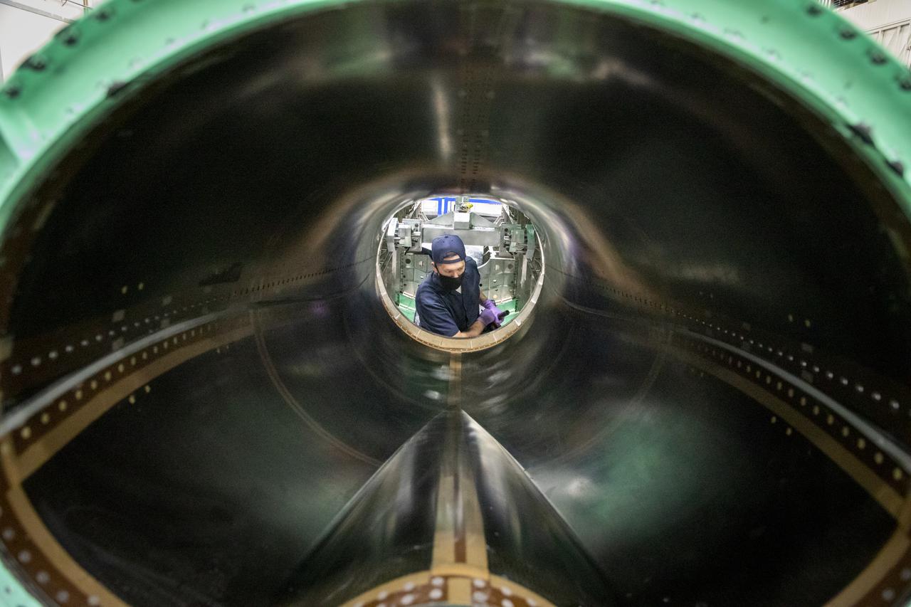 A technician is working on the engine inlet of NASA’s X-59 Quiet Supersonic Technology (QueSST) aircraft at Lockheed Martin’s Skunk Works facility in Palmdale, California.