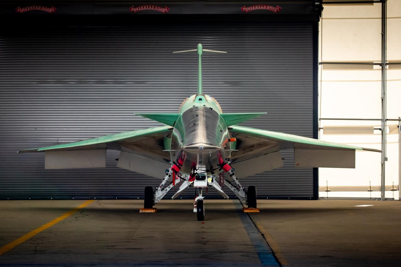 NASA’s X-59 aircraft is parked near the runway at Lockheed Martin Skunk Works in Palmdale, California, on June 19, 2023. This is where the X-59 will be housed during ground and initial flight tests.  Lockheed Martin Photography By Garry Tice 1011 Lockheed Way, Palmdale, Ca. 93599 Event: Move to Run Stall 5 Date: 6/19/2023 Additional Info: