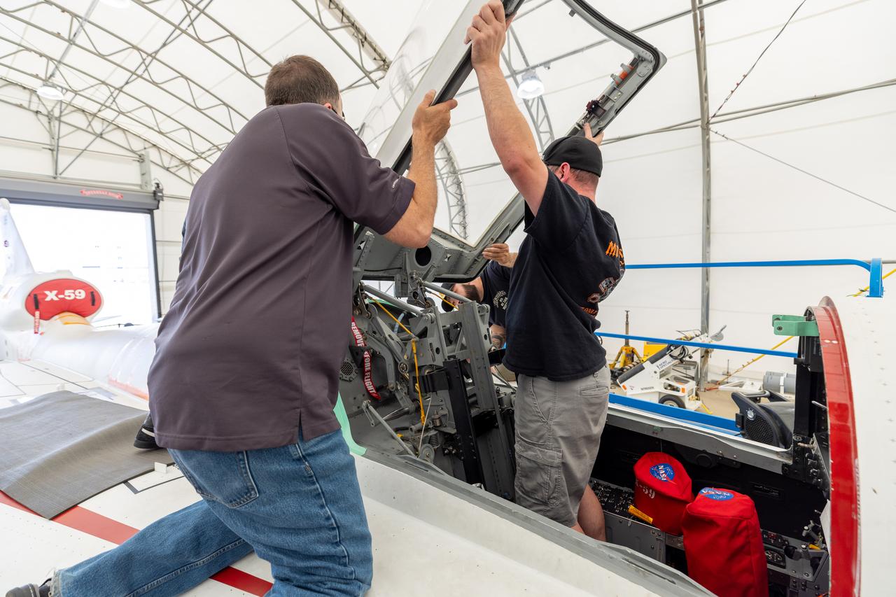 Lockheed Martin technicians temporarily remove the canopy from the X-59 in preparation for final installation of the ejection seat into the aircraft. 