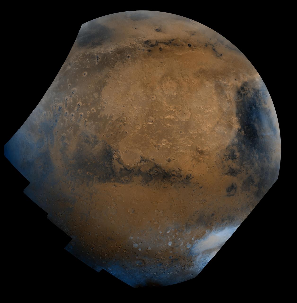This mosaic is composed of about 100 red- and violet- filter Viking Orbiter images, digitally mosaiced in an orthographic projection at a scale of 1 km/pixel. The images were acquired in 1980 during mid northern summer on Mars (Ls = 89 degrees). The center of the image is near the impact crater Schiaparelli (latitude -3 degrees, longitude 343 degrees). The limits of this mosaic are approximately latitude -60 to 60 degrees and longitude 280 to 30 degrees. The color variations have been enhanced by a factor of two, and the large-scale brightness variations (mostly due to sun-angle variations) have been normalized by large-scale filtering. The large circular area with a bright yellow color (in this rendition) is known as Arabia. The boundary between the ancient, heavily-cratered southern highlands and the younger northern plains occurs far to the north (latitude 40 degrees) on this side of the planet, just north of Arabia. The dark streaks with bright margins emanating from craters in the Oxia Palus region (to the left of Arabia) are caused by erosion and/or deposition by the wind. The dark blue area on the far right, called Syrtis Major Planum, is a low-relief volcanic shield of probable basaltic composition. Bright white areas to the south, including the Hellas impact basin at the lower right, are covered by carbon dioxide frost.   http://photojournal.jpl.nasa.gov/catalog/PIA00004