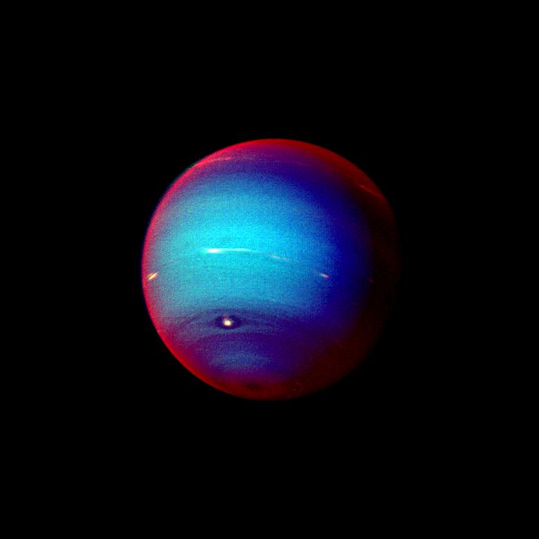 This false color photograph of Neptune was made from Voyager 2 images taken through three filters: blue, green, and a filter that passes light at a wavelength that is absorbed by methane gas.