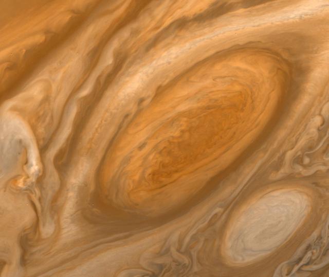 This mosaic of Jupiter Great Red Spot taken by NASA Voyager 1, shows the area around the northern boundary where a white cloud is seen which extends to east of the region.  http://photojournal.jpl.nasa.gov/catalog/PIA00065