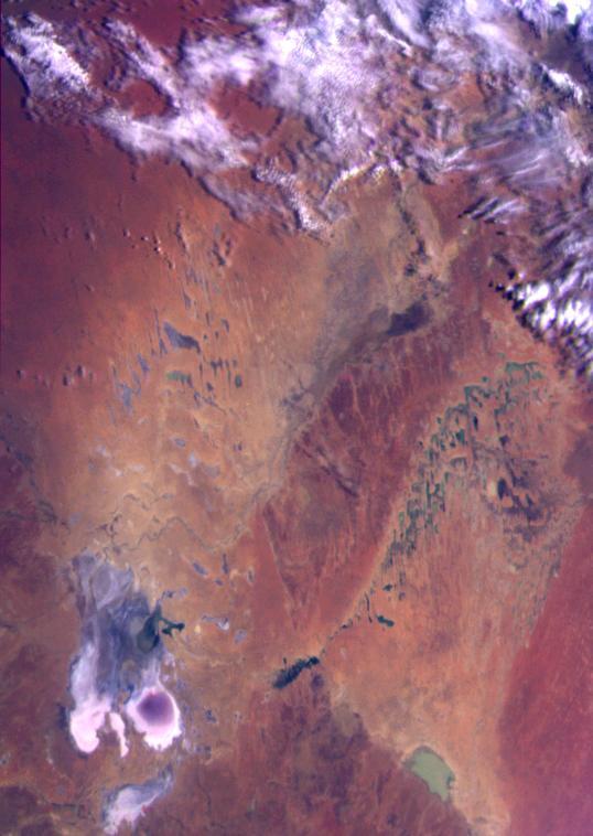 This color image of the Simpson Desert in Australia was obtained by NASA’s Galileo spacecraft at about 2:30 p.m. PST, Dec. 8, 1990, at a range of more than 35,000 miles.   http://photojournal.jpl.nasa.gov/catalog/PIA00115