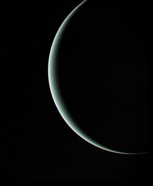 This view of pale blue-green Uranus was recorded by NASA's Voyager 2 on Jan 25, 1986, as the spacecraft left the planet behind. The thin crescent of Uranus is seen here between the spacecraft, the planet and the Sun. http://photojournal.jpl.nasa.gov/catalog/PIA00143