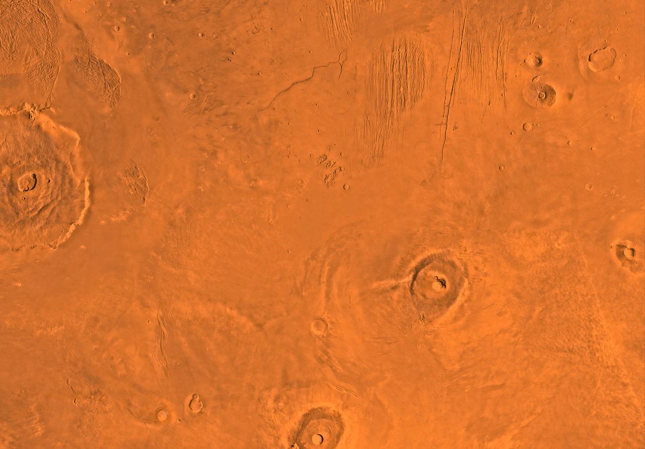 Mars digital-image mosaic merged with color of the MC-9 quadrangle, Tharsis region of Mars. This image is from NASA's Viking Orbiter 1. http://photojournal.jpl.nasa.gov/catalog/PIA00169