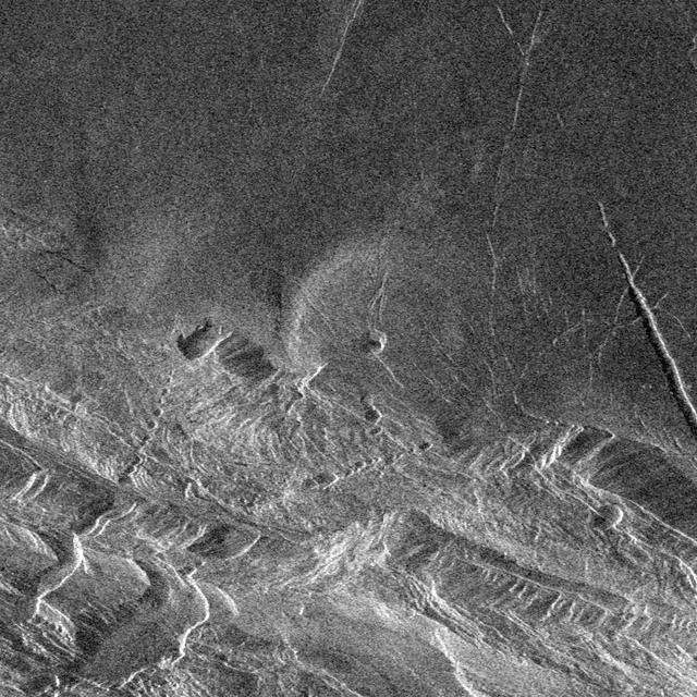 Southwest Lakshmi Planum plains is bounded on the south by the Danu Montes mountains as shown by NASA Magellan spacecraft. http://photojournal.jpl.nasa.gov/catalog/PIA00249