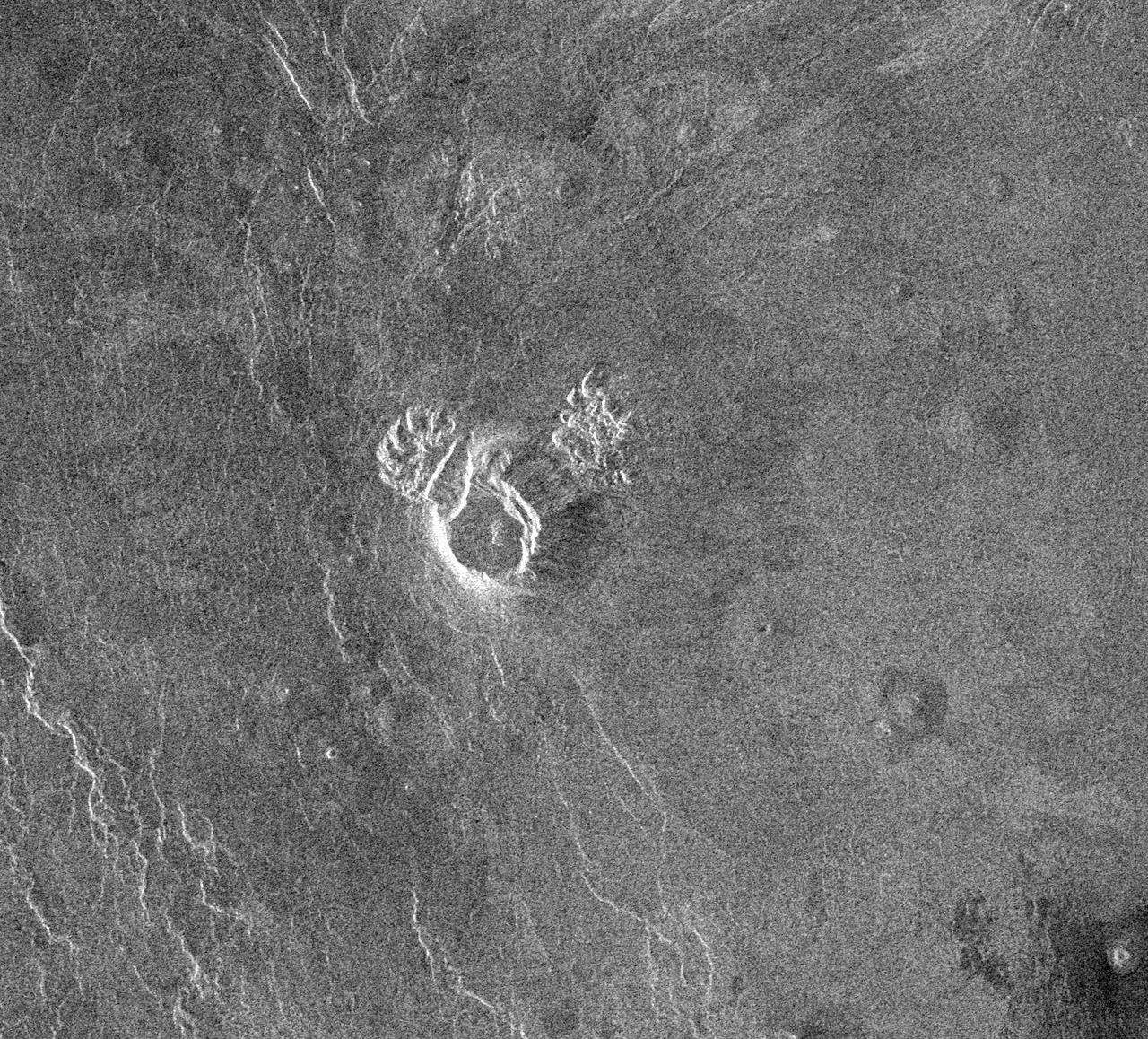 NASA Magellan spacecraft observed remnant landslide deposits apparently resulting from the collapse of volcanic structures. This radar image is centered in the southwestern Navka Region of Venus. http://photojournal.jpl.nasa.gov/catalog/PIA00262