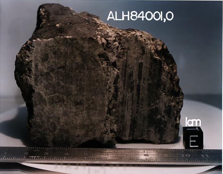 This 4.5 billion-year-old rock, labeled meteorite ALH84001, is one of 10 rocks from Mars in which researchers have found organic carbon compounds that originated on Mars without involvement of life.  http://photojournal.jpl.nasa.gov/catalog/PIA00289