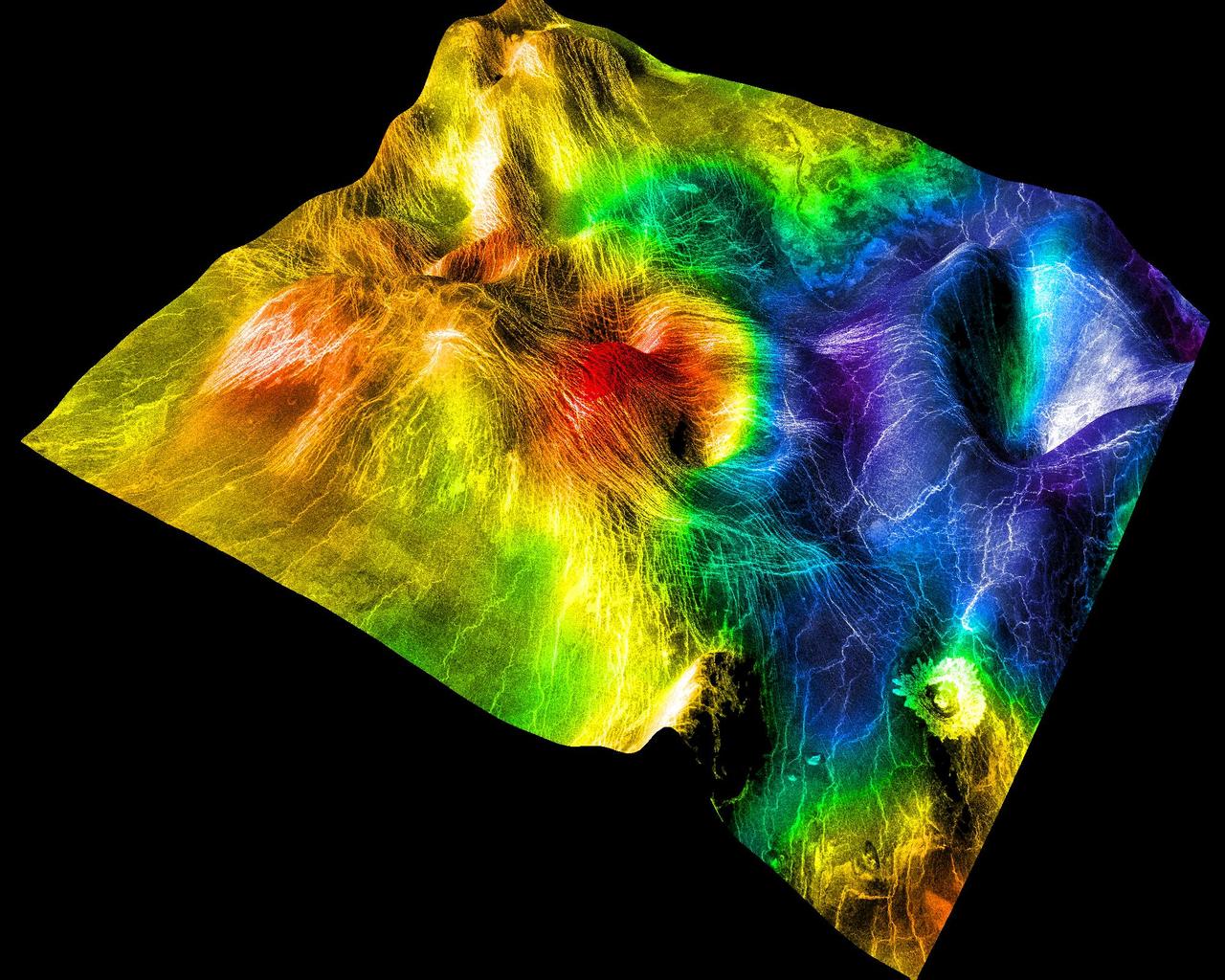 This perspective view of Venus, generated by computer from NASA Magellan data and color-coded with emissivity, shows part of the lowland plains in Sedna Planitia.  http://photojournal.jpl.nasa.gov/catalog/PIA00307