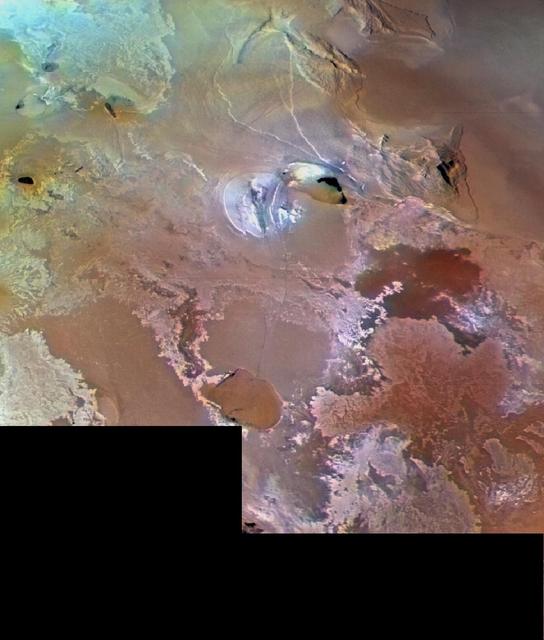 Io volcanic plains are shown in this archival image from NASA Voyager 1, which spans an area about 1030 km 640 miles from left to right. Numerous volcanic calderas and lava flows are visible.  http://photojournal.jpl.nasa.gov/catalog/PIA00324