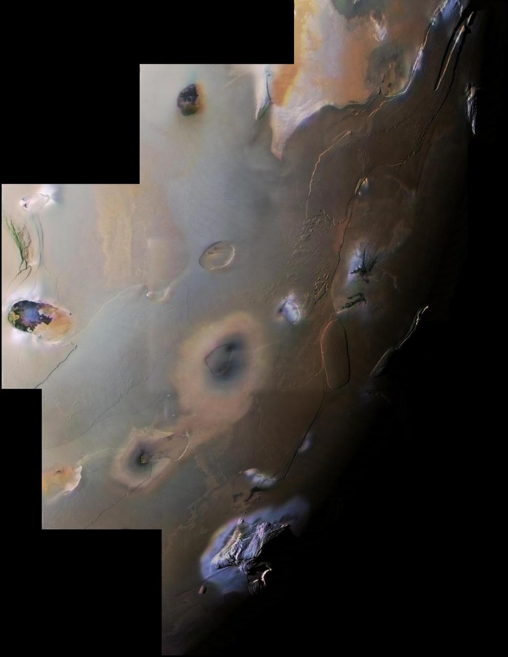 This archival image mosaic from NASA Voyager 1 shows Io south polar region. The South Pole is near the terminator line between daylight and night at right center. Haemus Mons, a 10-km high 32,000 foot mountain is at bottom.    http://photojournal.jpl.nasa.gov/catalog/PIA00327