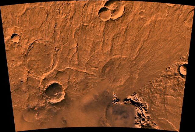 A color image of the Amphitrites Patera region of Mars; north toward top. The scene shows several indistinct ring structures and radial ridges of an old volcano named Amphitrites Patera. A patera (Latin for shallow dish or saucer) is a volcano of broad areal extent with little vertical relief. This image is a composite of NASA's Viking medium-resolution images in black and white and low-resolution images in color. The image extends from latitude 55 degrees S. to 62 degrees S. and from longitude 292 degrees to 311 degrees; Lambert projection. Amphitrites Patera is a 138-km-diameter feature on the south rim of Hellas impact basin and is one of many indistinct ring structures in the area. The location of the paterae in this area of Hellas indicates that their source magma may have been influenced by the transition fractures of the basin. The radial ridges of Amphitrites extend for about 400 km north into the Hellas basin. http://photojournal.jpl.nasa.gov/catalog/PIA00410