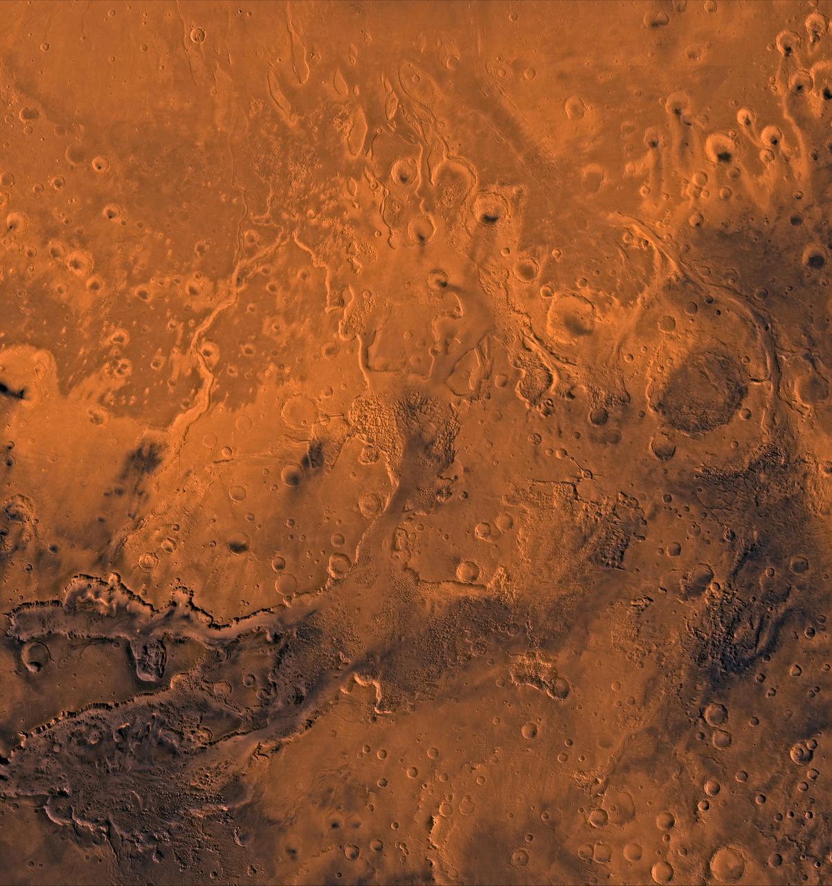 A color image of the south Chryse basin Valles Marineris outflow channels on Mars; north toward top. The scene shows on the southwest corner the chaotic terrain of the east part of Valles Marineris and two of its related canyons: Eos and Capri Chasmata (south to north). Ganges Chasma lies directly north. The chaos in the southern part of the image gives rise to several outflow channels, Shalbatana, Simud, Tiu, and Ares Valles (left to right), that drained north into the Chryse basin. The mouth of Ares Valles is the site of the Mars Pathfinder lander.  This image is a composite of NASA's Viking medium-resolution images in black and white and low-resolution images in color. The image extends from latitude 20 degrees S. to 20 degrees N. and from longitude 15 degrees to 53 degrees; Mercator projection.  http://photojournal.jpl.nasa.gov/catalog/PIA00418