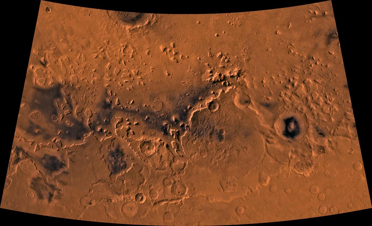 Color image of part of the Ismenius Lacus region of Mars (MC-5 quadrangle) containing the impact crater Moreux (right center); north toward top. The scene shows heavily cratered highlands in the south on relatively smooth lowland plains in the north separated by a belt of dissected terrain, containing flat-floored valleys, mesas, and buttes. This image is a composite of Viking medium-resolution images in black and white and low-resolution images in color. The image extends from latitude 36 degrees N. to 50 degrees N. and from longitude 310 degrees to 340 degrees; Lambert conformal conic projection. The dissected terrain along the highlands/lowlands boundary consists of the flat-floored valleys of Deuteronilus Mensae (on left) and Prontonilus Mensae (on right) and farther north the small, rounded hills of knobby terrain. Flows on the mensae floors contain striae that run parallel to valley walls; where valleys meet, the striae merge, similar to medial moraines on glaciers. Terraces within the valley hills have been interpreted as either layered rocks or wave terraces. The knobby terrain has been interpreted as remnants of the old, densely cratered highland terrain perhaps eroded by mass wasting. http://photojournal.jpl.nasa.gov/catalog/PIA00420