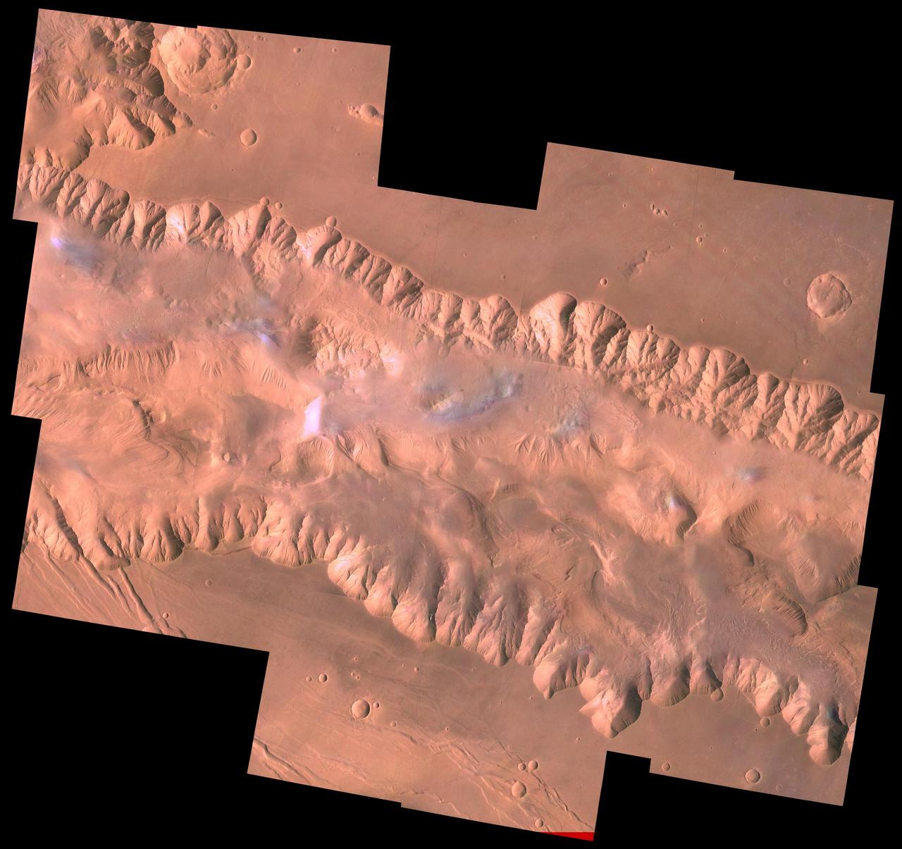 During its examination of Mars, NASA's Viking 1 spacecraft returned images of Valles Marineris, a huge canyon system 5,000 km long, up to 240 km wide, and 6.5 km deep, whose connected chasma or valleys may have formed from a combination of erosional collapse and structural activity. The view shows east Candor Chasma, one of the connected valleys of Valles Marineris; north toward top of frame; for scale, the impact crater in upper right corner is 15 km (9 miles) wide. The image, centered at latitude 7.5 degrees S., longitude 67.5 degrees, is a composite of Viking 1 Orbiter high-resolution (about 80 m/pixel or picture element) images in black and white and low-resolution (about 250 m/pixel) images in color. The Viking 1 craft landed on Mars in July of 1976. East Candor Chasma occupies the eastern part of the large west-northwest-trending trough of Candor Chasma. This section is about 150 km wide. East Candor Chasma is bordered on the north and south by walled cliffs, most likely faults. The walls may have been dissected by landslides forming reentrants; one area on the north wall shows what appears to be landslide debris. Both walls show spur-and-gully morphology and smooth sections. In the lower part of the image northwest-trending, linear depressions on the plateau are younger graben or fault valleys that cut the south wall. Material central to the chasma shows layering in places and has been locally eroded by the wind to form flutes and ridges. These interior layered deposits have curvilinear reentrants carved into them, and in one locale a lobe flows away from the top of the interior deposit. The lobe may be mass-wasting deposits due to collapse of older interior deposits (Lucchitta, 1996, LPSC XXVII abs., p. 779- 780); this controversial idea requires that the older layered deposits were saturated with ice, perhaps from former lakes, and that young volcanism and/or tectonism melted the ice and made the material flow. http://photojournal.jpl.nasa.gov/catalog/PIA00424